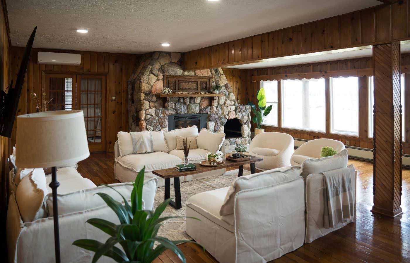 Lodge great room with lake facing views and community fireplace Lodge great room with lake facing views and community fireplace