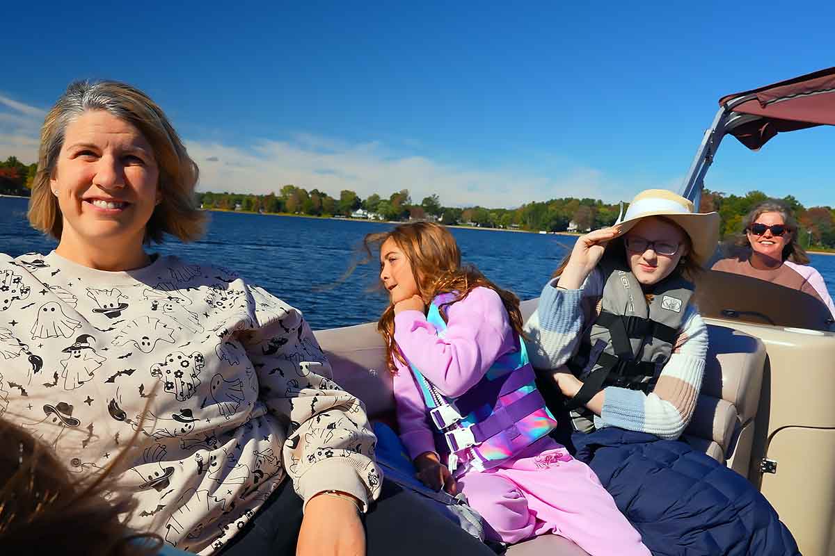 family-vacations-life-on-the-boat Family on the lake at South Shore R&R western Michigan cabin rental