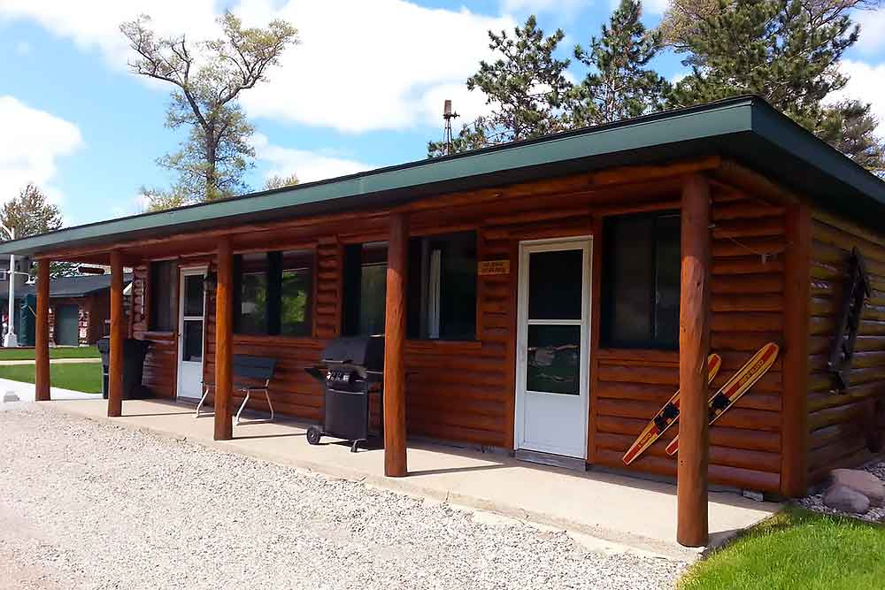 Ontario Cabin exterior with outdoor fire pit at South Shore Resort & Retreats Twin Lake Michigan