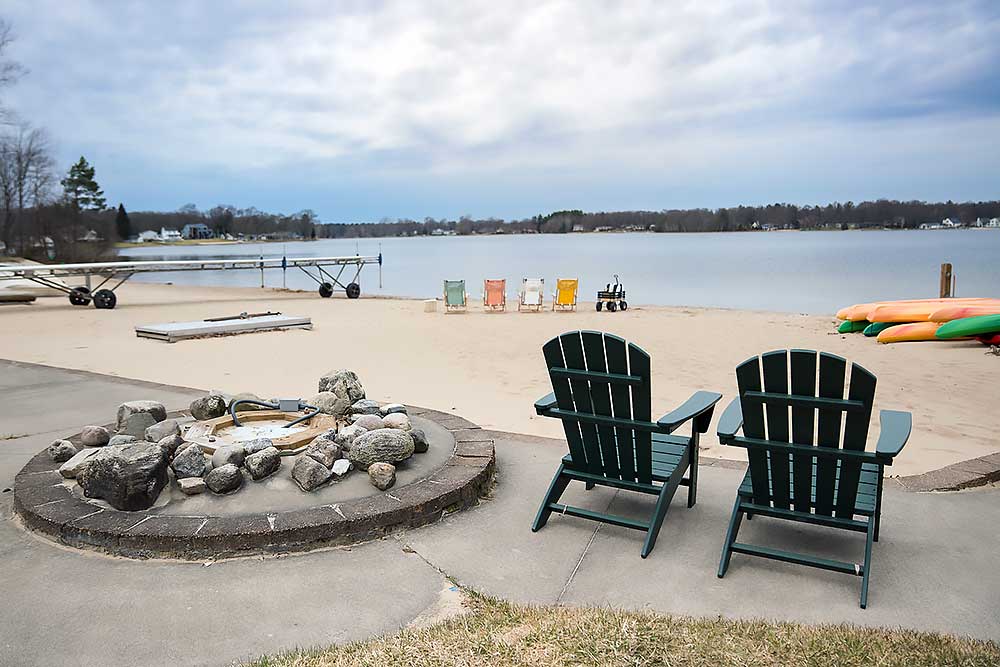 our-grounds-amenties-fire-pit Fire pit gathering at South Shore Resort and Retreats western Michigan