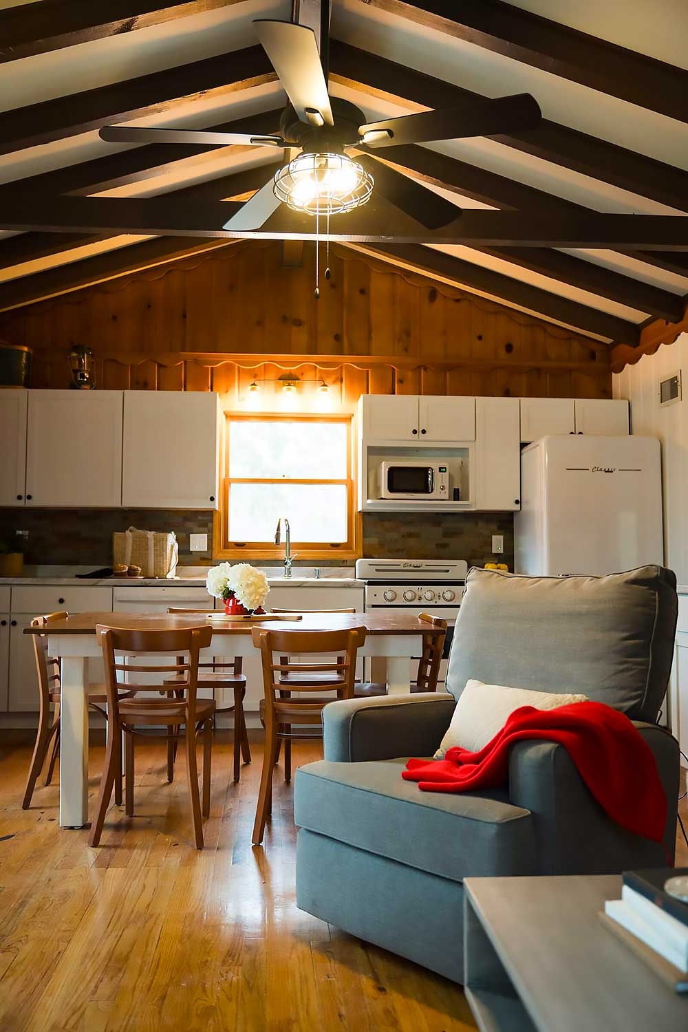 Superior Cabin exterior with fire pit and private patio at South Shore Resort & Retreats Twin Lake Michigan